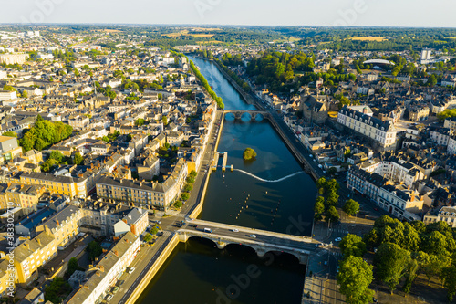 View from drone of houses and Mayenne river at Laval town at sunny summer day, France photo