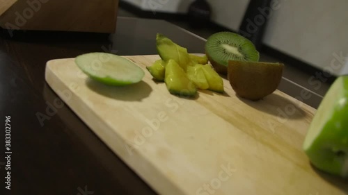 Woman cutting apple on the table