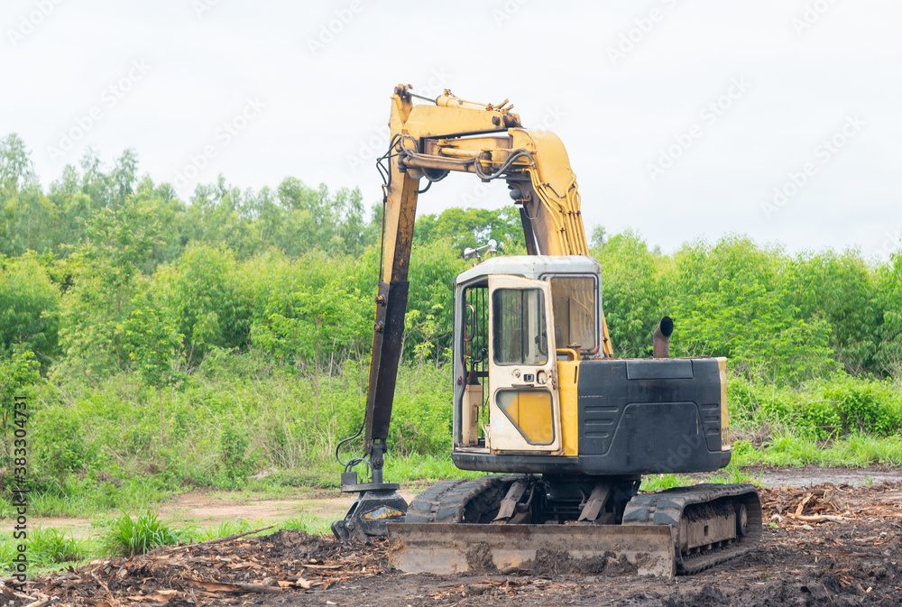 An old yellow excavator.