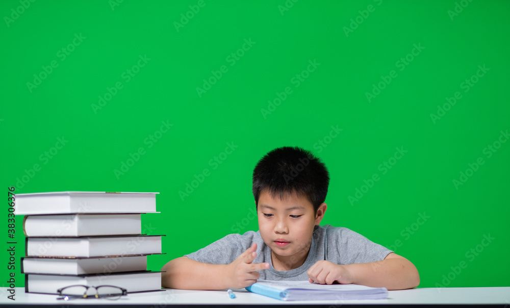 boy doing homework on green screen, child writing paper, education concept, back to school
boy doing homework on green screen, child writing paper, education concept, back to school
