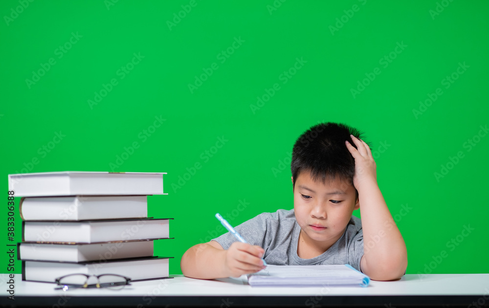 Student doing homework on green screen, child writing paper, education concept, back to school
Student doing homework on green screen, child writing paper, education concept, back to school
