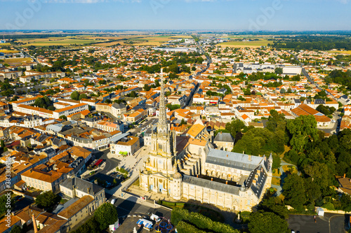 Scenic aerial view of French commune of Lucon with famous Cathedral of Notre Dame of the Assumption