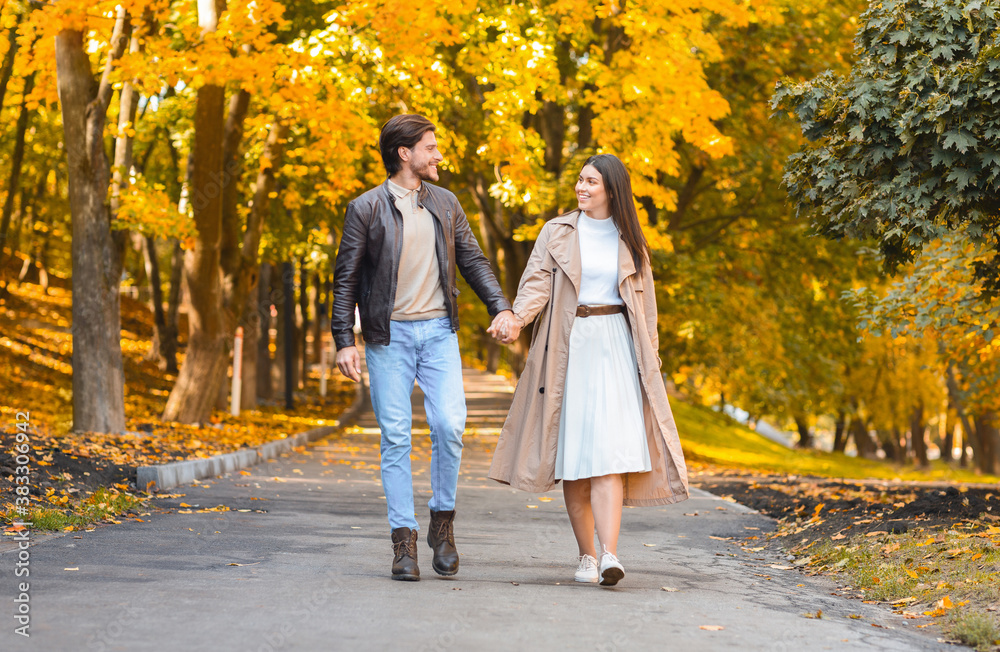 Beautiful picture of couple in love walking by autumn forest Beautiful picture of couple in love walking by autumn forest