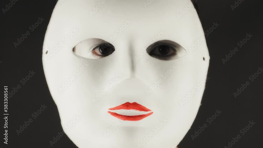 Portrait of a mime and bodypainting woman in white with black lips. Mime woman on black background. Portrait of a mime and bodypainting woman in white with black lips. Mime woman on black background.