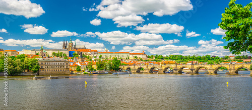 Panorama of Prague city historical centre with Prague Castle, St. Vitus Cathedral in Hradcany district, Charles Bridge Karluv Most across Vltava river. Panoramic view of Prague city, Czech Republic