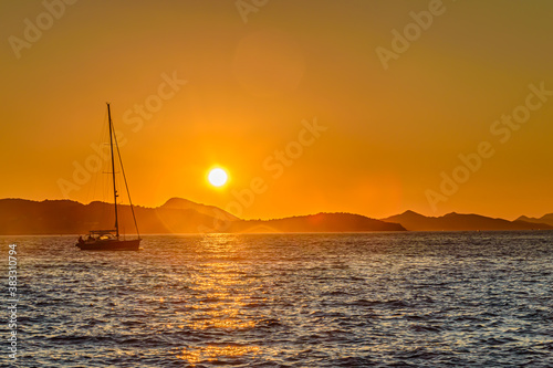 Boat sailing at sunset © Vedad Ceric