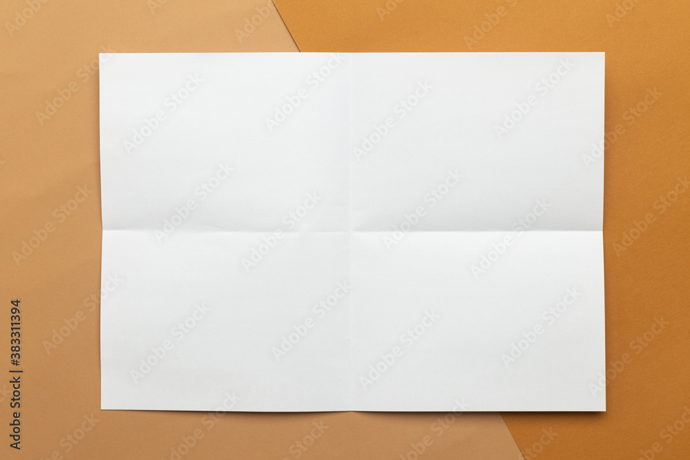 Blank poster brochure a4 size mockup template on half beige and brown background.