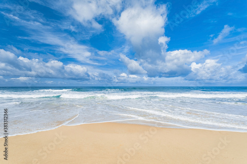 Summer beach background with sunny sky at the sea