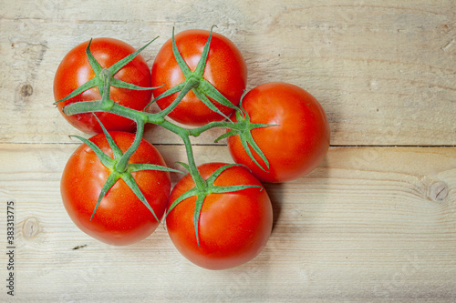 Tomatoes on a wood background. Vegetables diet
