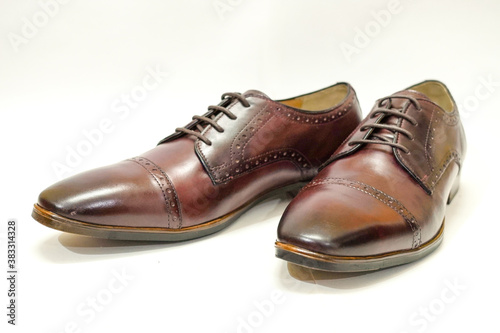 pair of brown leather shoes © MERAKIANS MEDIA