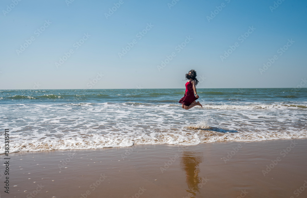 Young girl of Indian ethnocity jumping Young girl of Indian ethnocity jumping