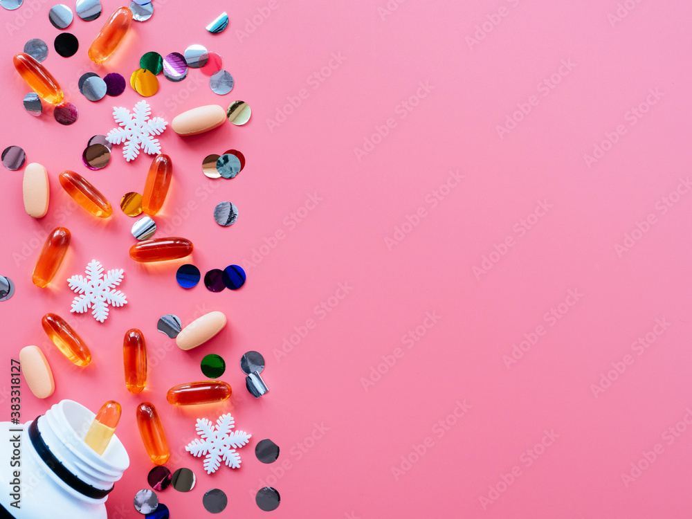 Pills, confetti, Christmas toys on a pink background, flatly, copyspace fall out of the jar. Medical banner concept for new year or Christmas. Ideas for Christmas medical promotions Pills, confetti, Christmas toys on a pink background, flatly, copyspace fall out of the jar. Medical banner concept for new year or Christmas. Ideas for Christmas medical promotions