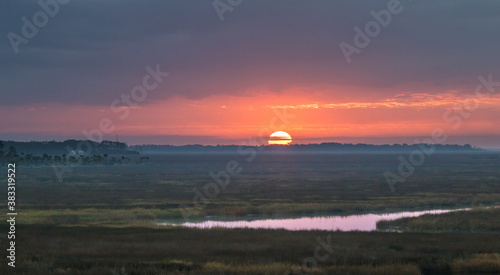 Принти на полотні Sunrise over the salt grass marsh near St Marys, Georgia