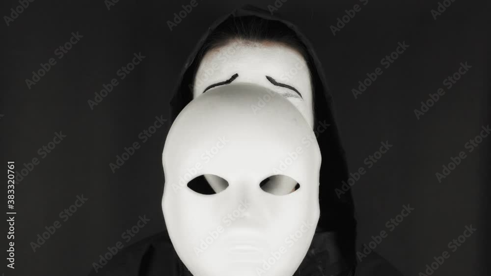 Portrait of a mime and bodypainting woman in white with black lips. Mime woman on black background. Portrait of a mime and bodypainting woman in white with black lips. Mime woman on black background.