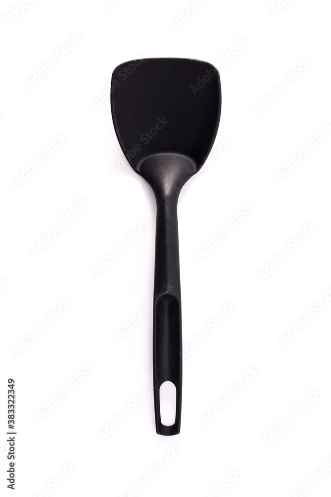 Black plastic kitchen spoon isolated on white background Black plastic kitchen spoon isolated on white background