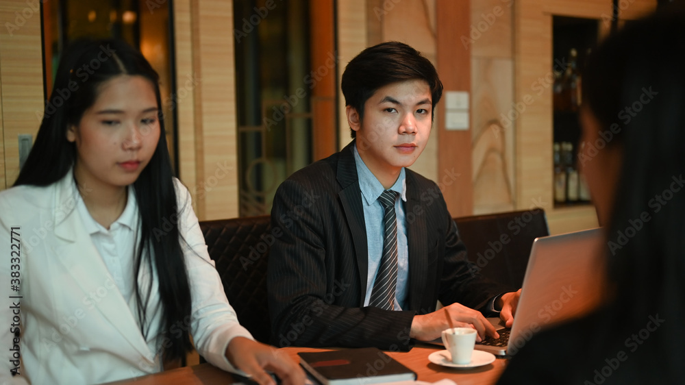 Group of a young business people brainstorming and discussing business plan at meeting room. Group of a young business people brainstorming and discussing business plan at meeting room.