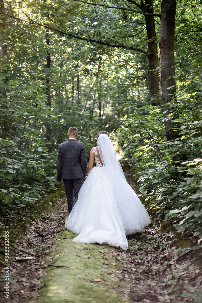 bride and groom in the forest