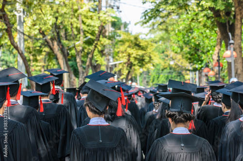The shot of graduation hats and the back of graduates during commencement success graduates of the university in the Graduation Ceremony. Concept education congratulation of graduates in University.