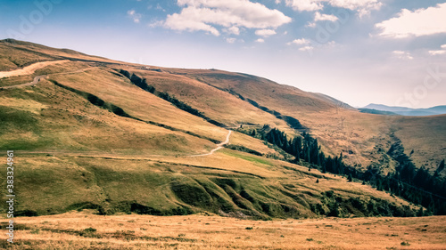 Mountain landscape in the Vulcan Pass, Jiu Valley, Romania, Europe. The view on top of the mountains. Alpine scenery. Autumn sunset.