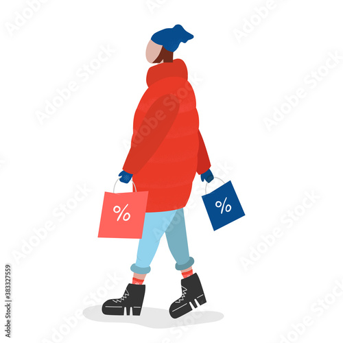 Woman in puffer jacket after winter shopping