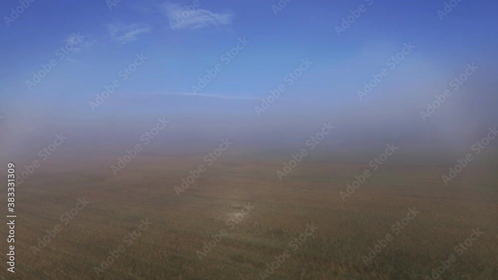 Harvested Fields Drowned in Thick Morning Fog. Aerial Pedestal Up Harvested Fields Drowned in Thick Morning Fog. Aerial Pedestal Up