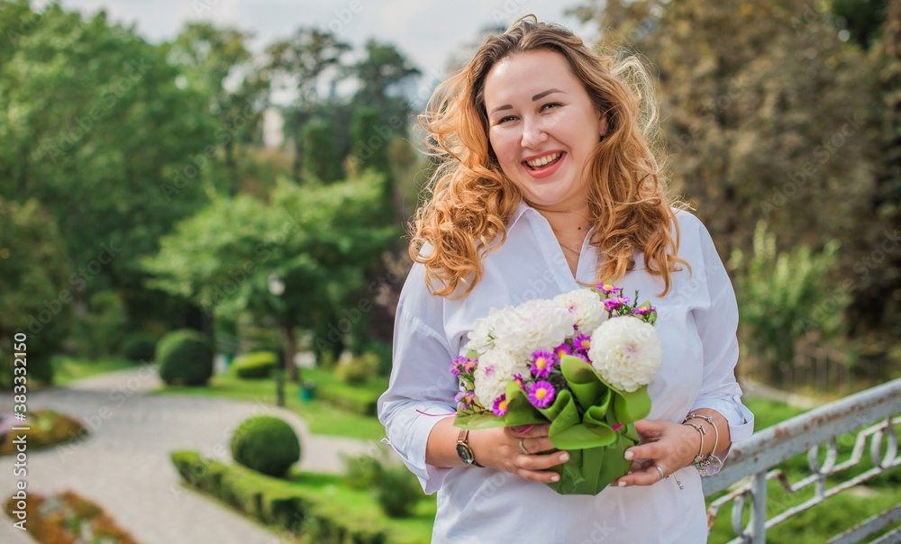 Fototapeta premium Happy smiling beautiful plus size model . Portrait large girl smiling on a sunny day with good mood, Photo of new age standard of beauty