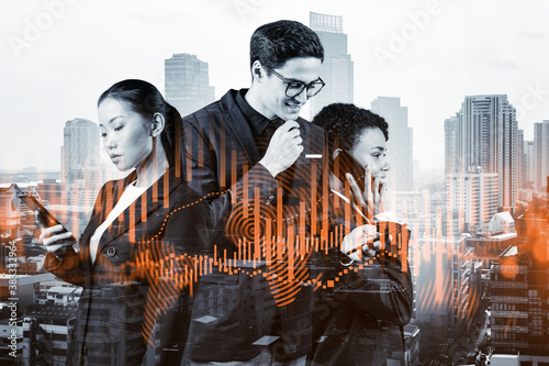 Group of business colleagues in suits as a part of multinational corporate team working on forecasting trading corporate strategy at fund. Forex chart. Bangkok on background. Double exposure © VideoFlow