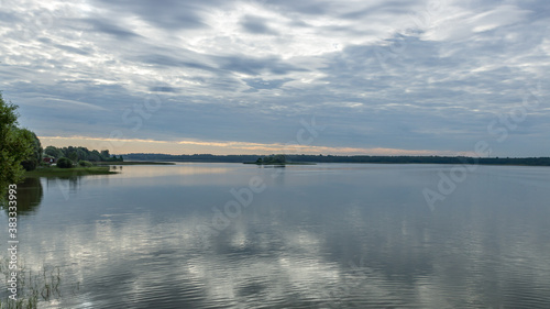 Morning reflection on the lake in the city of Bologoe © Iurii