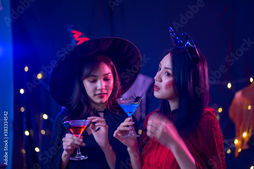 young Asian woman wearing costume in Halloween festival party