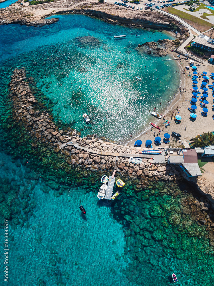 Beautiful aerial view over crystal clear waters  of Mediterranean sea and top beach in Protaras, Cyprus - perfect summer vacation, escape 