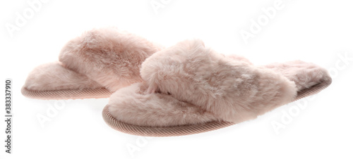 Pair of stylish soft slippers on white background