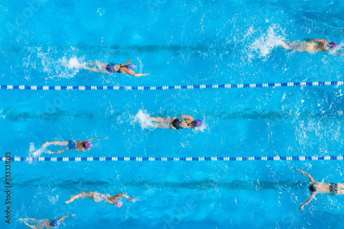 Canvas Print People training in swimming pool, top view