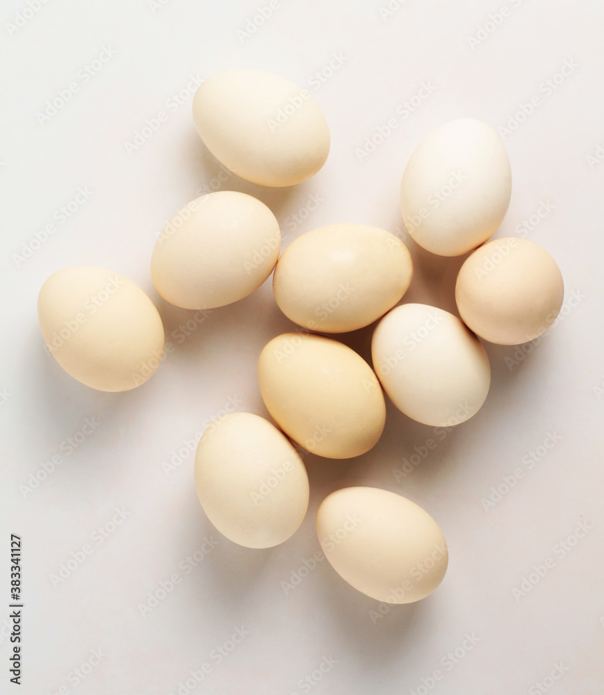 Chicken eggs on a white background. White egg. Top view Chicken eggs on a white background. White egg. Top view