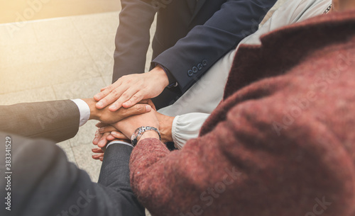 Business people shaking hands, putting their hands together, finishing up meeting. Deal Successful