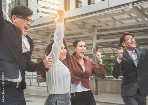 Success Team of asian young businessman and businesswoman jump celebrate finishing big project. Teamwork of successful outdoors. together.
