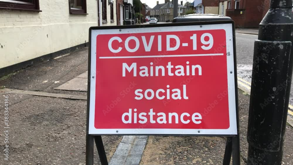 COVID-19 Maintain Social Distance, Road Signage on Public Street in the UK. Filmed October 2020. COVID-19 Maintain Social Distance, Road Signage on Public Street in the UK. Filmed October 2020.