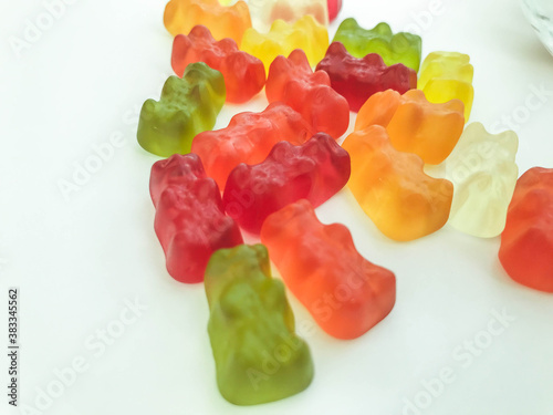 gelatinous, multi-colored, volumetric bears on a white matte background. vitamin product. gelatinous vitamins for children and adults. pills for beauty and youth