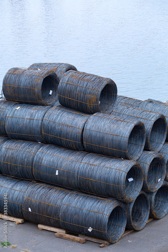 Steel low carbon wire rod, hot rolled steel drawing wire twelve millimeters or half an inch in diameter in coils. Freight transportation of heavy industry products by seaports. Export-import activity. Steel low carbon wire rod, hot rolled steel drawing wire twelve millimeters or half an inch in diameter in coils. Freight transportation of heavy industry products by seaports. Export-import activity.