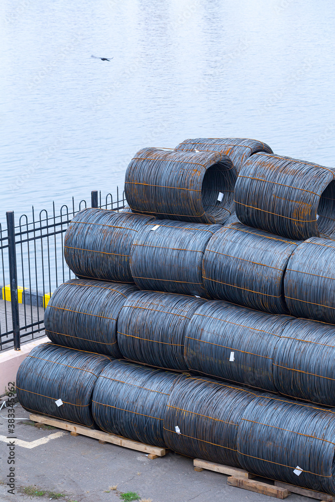 Steel low carbon wire rod, hot rolled steel drawing wire twelve millimeters or half an inch in diameter in coils. Freight transportation of heavy industry products by seaports. Export-import activity. Steel low carbon wire rod, hot rolled steel drawing wire twelve millimeters or half an inch in diameter in coils. Freight transportation of heavy industry products by seaports. Export-import activity.