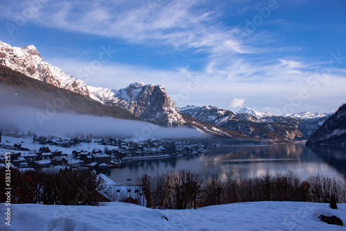 Amazing winter landscape with calm cold lake in Austrian alps.