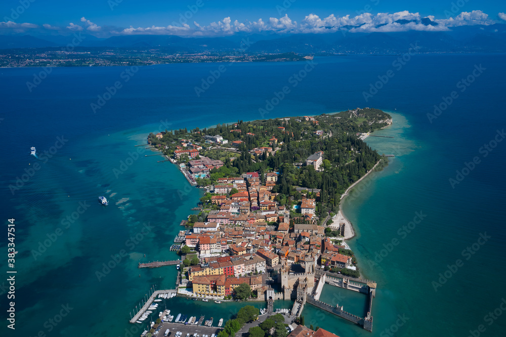 Aerial photography with drone. Aerial view on Sirmione sul Garda. Italy, Lombardy. Panoramic view at high altitude.  Rocca Scaligera Castle in Sirmione.