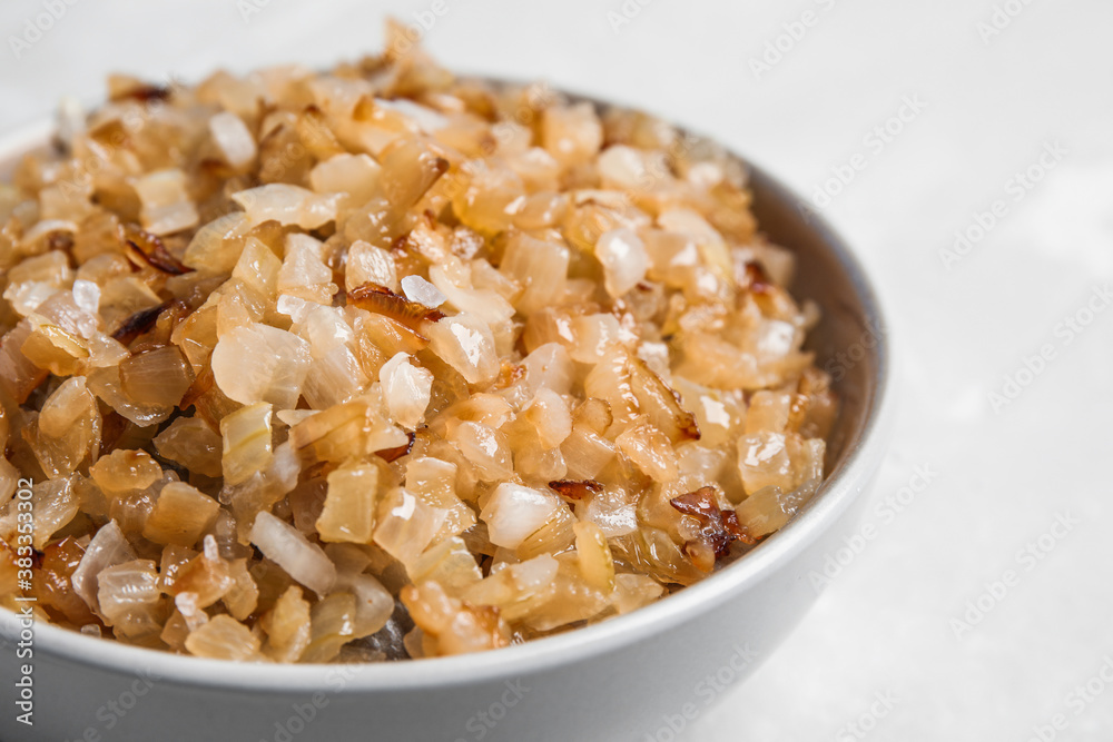 Tasty fried onion on light background, closeup
