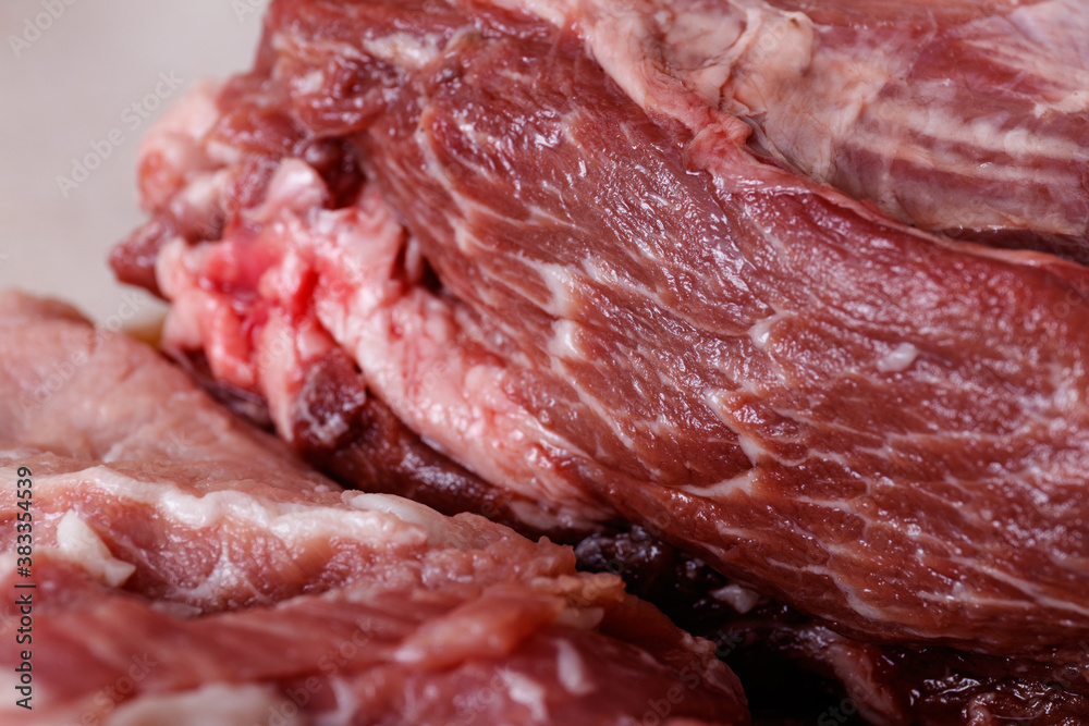 Close up of raw fresh meat on table.