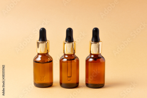 A set of amber bottles for essential oils and cosmetics. Glass bottle. Dropper  spray bottle