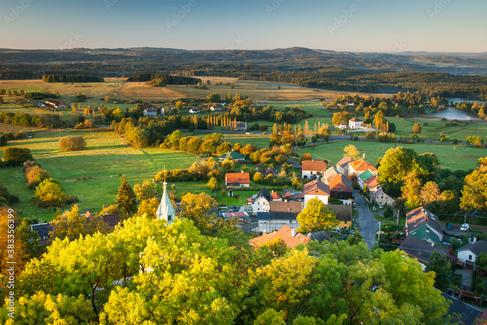 autumn view to the small village in the morning sun, czech republic