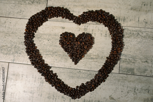 coffee beans hearts on wooden background