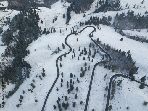 Long winding rural road with snow