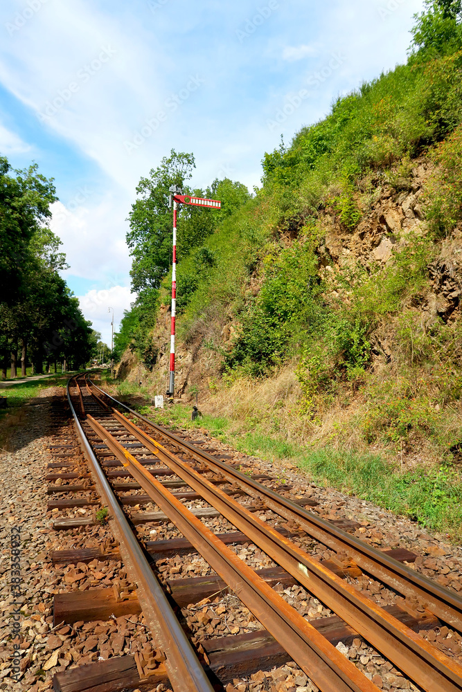 Fototapeta premium Industrial landscape with railroad in the nature. Railway junction in the bright summer day.