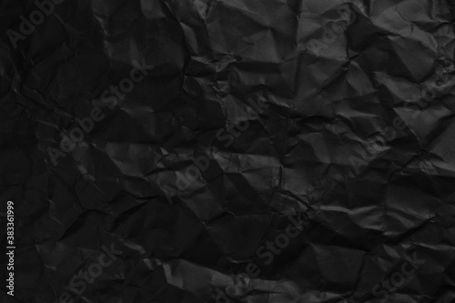 Black background texture of crumpled paper