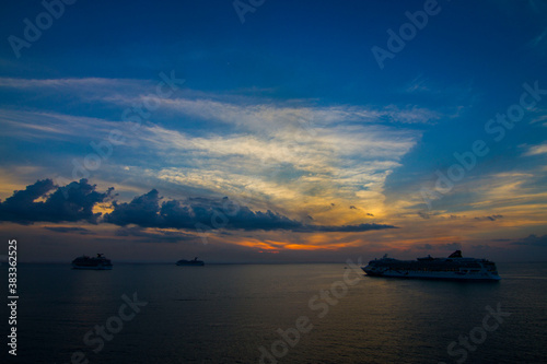 Cruise ships at sunset at sea